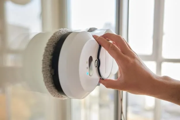 A homeowner meticulously cleaning a smart security camera lens with a microfiber cloth, in a well-lit living room, symbolizing careful preventative maintenance.