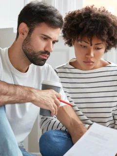 A couple learning how to get a Personal Loan.