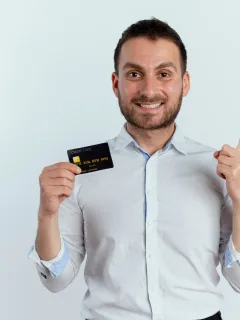 a man holding his Preferred Credit Card.