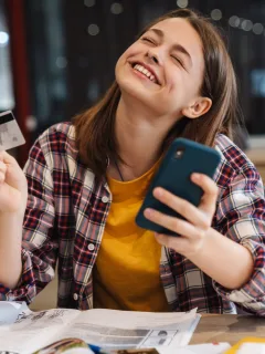 A happy woman with her Credit Card Rewards.
