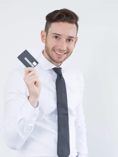 A man holding a Wells Fargo Active Cash Card.