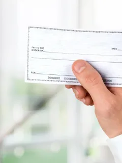 Someone learning How to fill out a check.