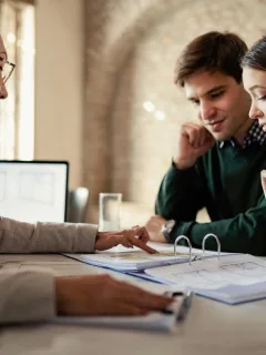 A couple learning about Pros and Cons of Personal Loans.