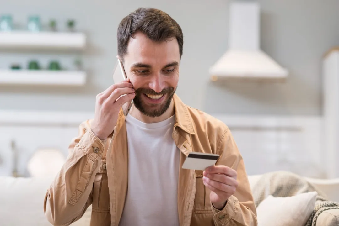A happy man learning more about Secured and Unsecured Credit Cards and how to choose one.