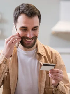 A happy man learning more about Secured and Unsecured Credit Cards and how to choose one.