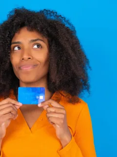 Woman holding her Discover it Balance Transfer.
