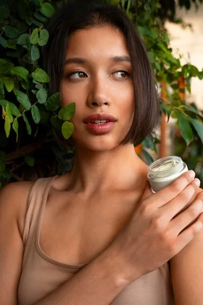 A close-up of a person gently applying a gel-based, oil-free moisturizer to their face, showcasing the lightweight texture and healthy glow.