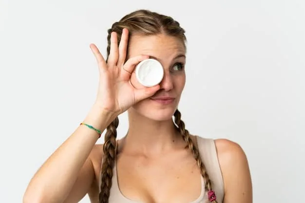 A close-up shot of a hand applying a pea-sized amount of eye cream to the under-eye area, demonstrating proper application technique. The focus is on the delicate skin and the product itself.