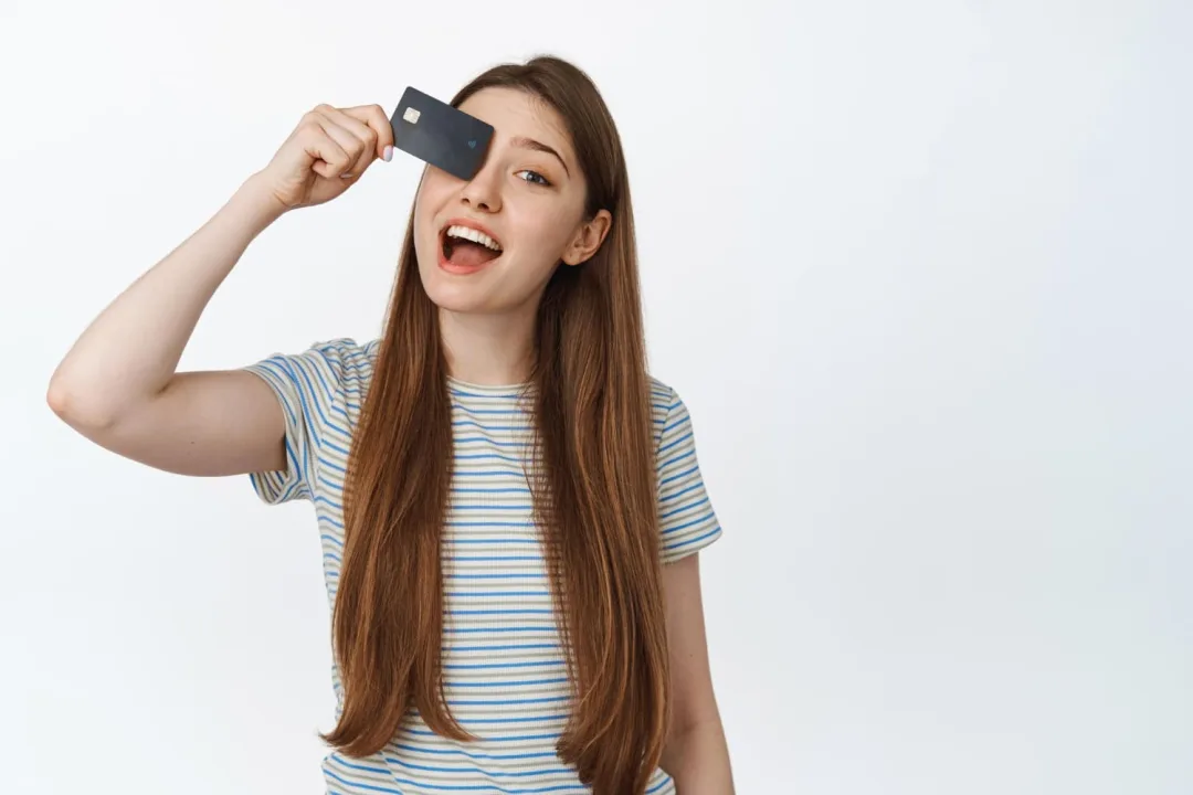 Woman holding her Citi Diamond Preferred card.