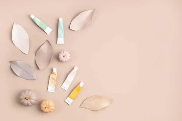 A detailed flat lay of various skincare products specifically formulated for dry skin: a creamy cleanser, a hyaluronic acid serum, a thick moisturizing cream, and a facial oil, all arranged aesthetically on a smooth, white surface.