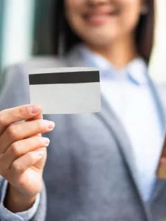 Woman holding her Citi Premier card.