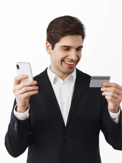A man holding e using his Citi Premier Card.