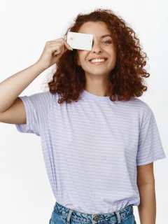 Happy girl with her US Bank Cash Visa Signature.