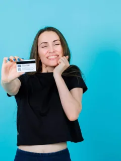 Woman holding her Simmons Visa Card