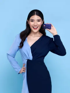 Woman holding her INK Business Preferred.