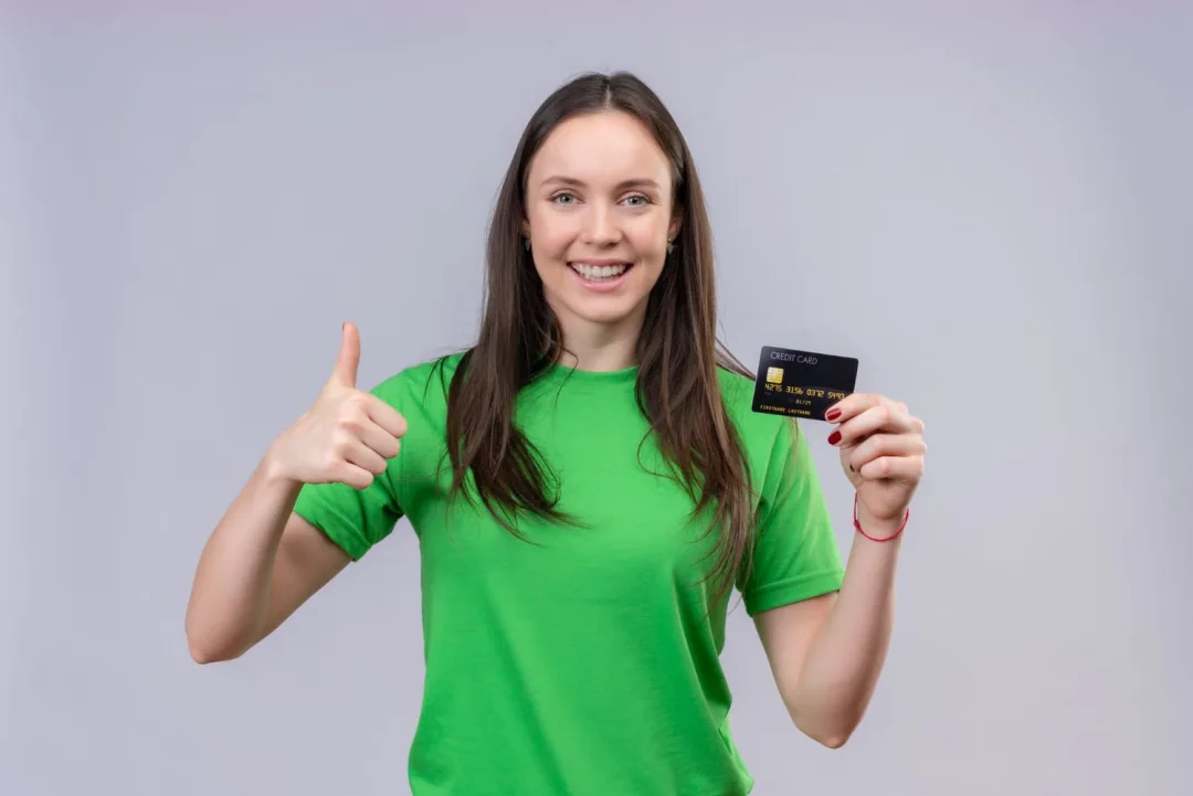 Woman holding her TD Cash Credit Card