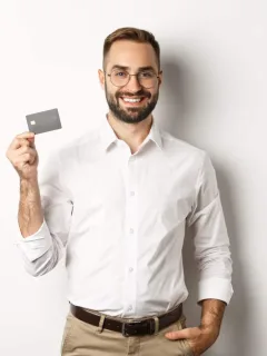 A man holding his Southwest Rapid Rewards Card.