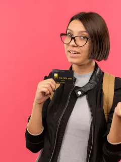 A woman holding her Bilt Mastercard.
