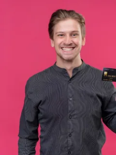 a man holding a GM Business Card.