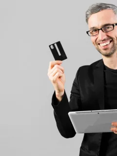 A man holding his GM Business Card.