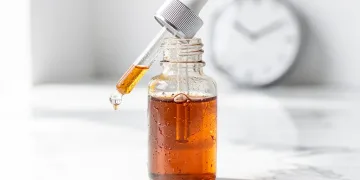 Oxidized Vitamin C serum in a dropper bottle, discolored and ineffective.