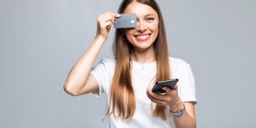 A girl using her Aeroplan Credit Card.