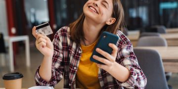 A happy woman with her Credit Card Rewards.