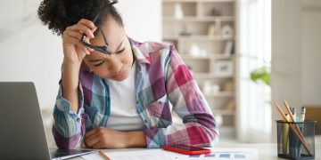 Woman learning how to Manage Debts.