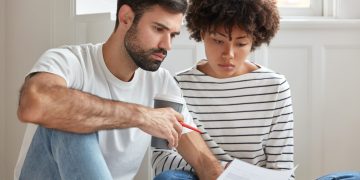 A couple learning how to get a Personal Loan.