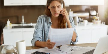 Woman trying to negotiate credit card debt.