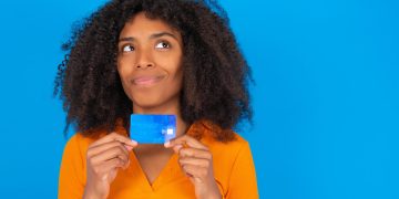 Woman holding her Discover it Balance Transfer.