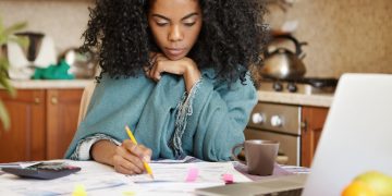 Woman learning how to Improve Financial Health.