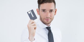 A man holding the Wells Fargo Active Cash.