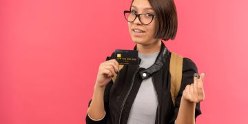 A woman holding her Bilt Mastercard.