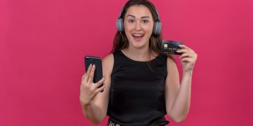 Woman holding her Bilt Mastercard.