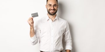 A man holding his Southwest Rapid Rewards Card.