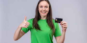 Woman holding her TD Cash Credit Card