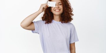 Happy girl with her US Bank Cash Visa Signature.