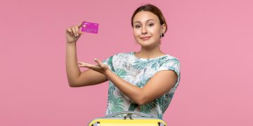 woman using travel credit cards.