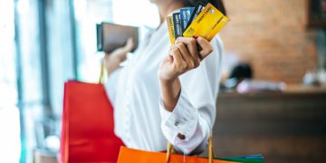 Woman learning about Foreign Transaction Fee.