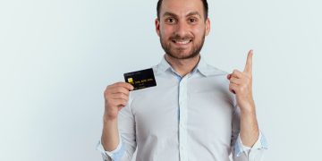 a man holding his Preferred Credit Card.