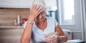 An old woman dealing with Financial Hangover.