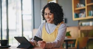 Woman learning how BNPL Impacting FICO Scores.