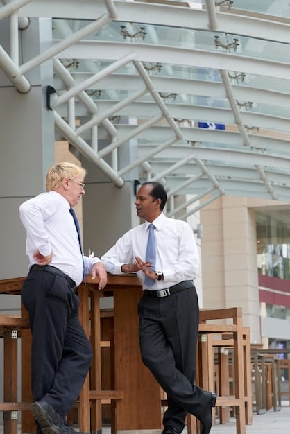 A handshake between a government official, an industry executive, and a trade school representative, symbolizing partnership and collaboration in addressing the construction labor shortage.