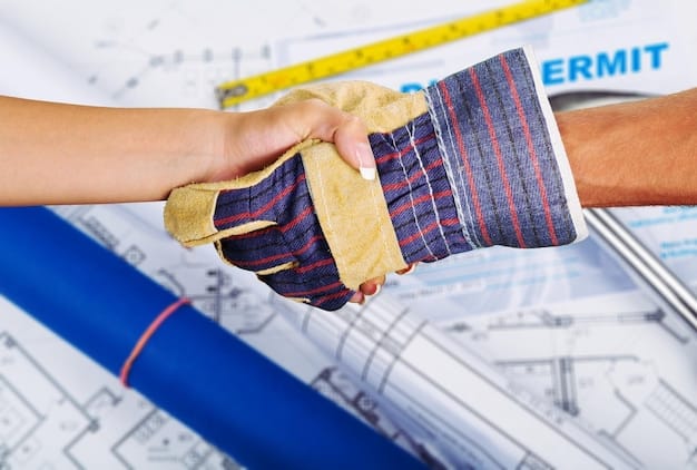 A close-up of two hands shaking over a construction blueprint, symbolizing strong contractual agreements and collaboration.
