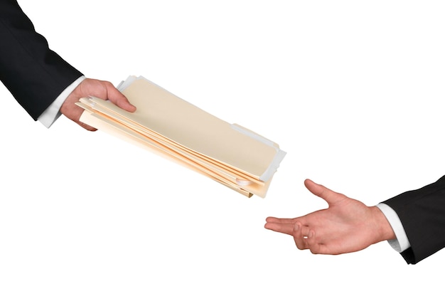 A handshake exchanged over a stack of legal documents with a 