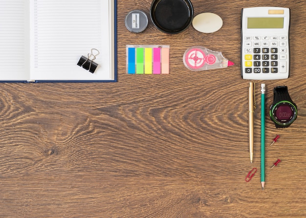 An overhead shot of a neatly organized home office desk with a detailed project plan, a financial budget spreadsheet open on a laptop, and a measuring tape, illustrating meticulous planning.