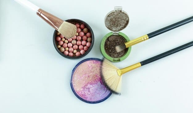 Overhead shot of a makeup artist's table with various setting powders, translucent and colored, along with powder brushes.