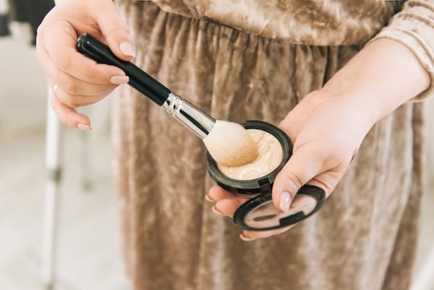 A makeup artist's hands using a large fluffy brush to apply translucent setting powder to a model's face, demonstrating professional application.