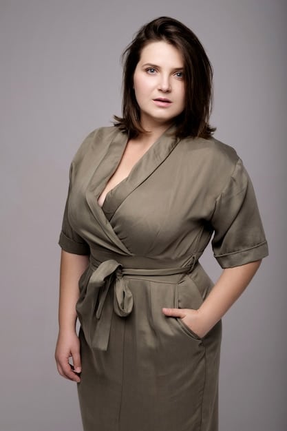 A woman with an hourglass body shape confidently wearing a beautifully tailored wrap dress that cinches at the waist, emphasizing her natural curves.